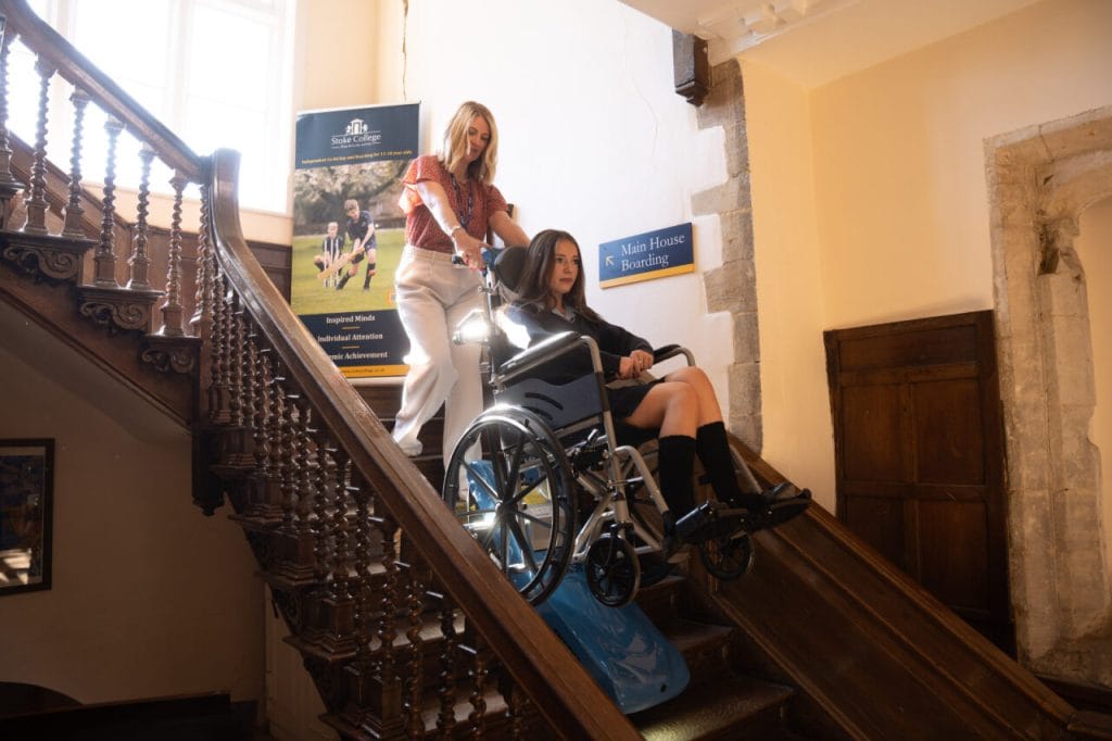 A stair climber being used on stairs of a public school building ...